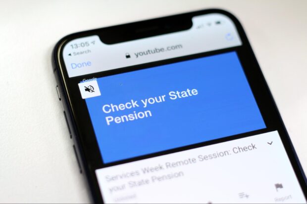 A mobile phone showing a video recording of a service design case study from the Check your State Pension team