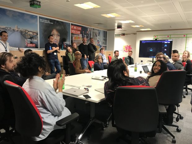 The Department for International Trade data team is gathered around a conference table.