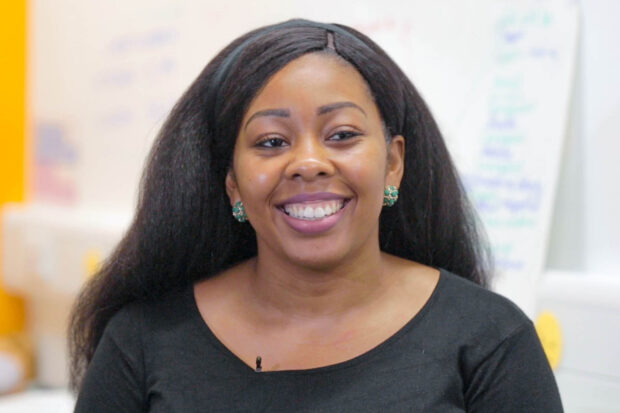 Monica Ukandu facing the camera and smiling