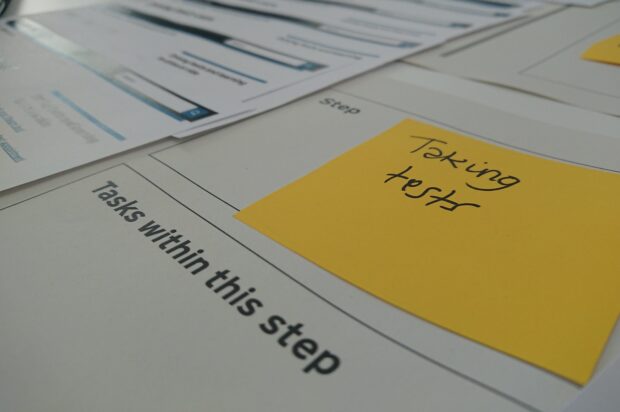 A post-it note that says 'taking tests' in a box labelled 'step'. Below is a box labelled 'tasks within this step'.