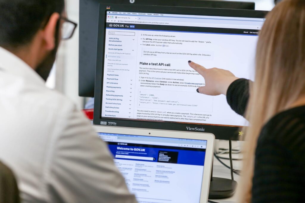 Two writers looking at content in the technical documentation tool