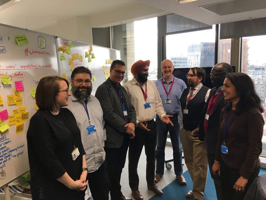 A group of consulting technical architects in a huddle