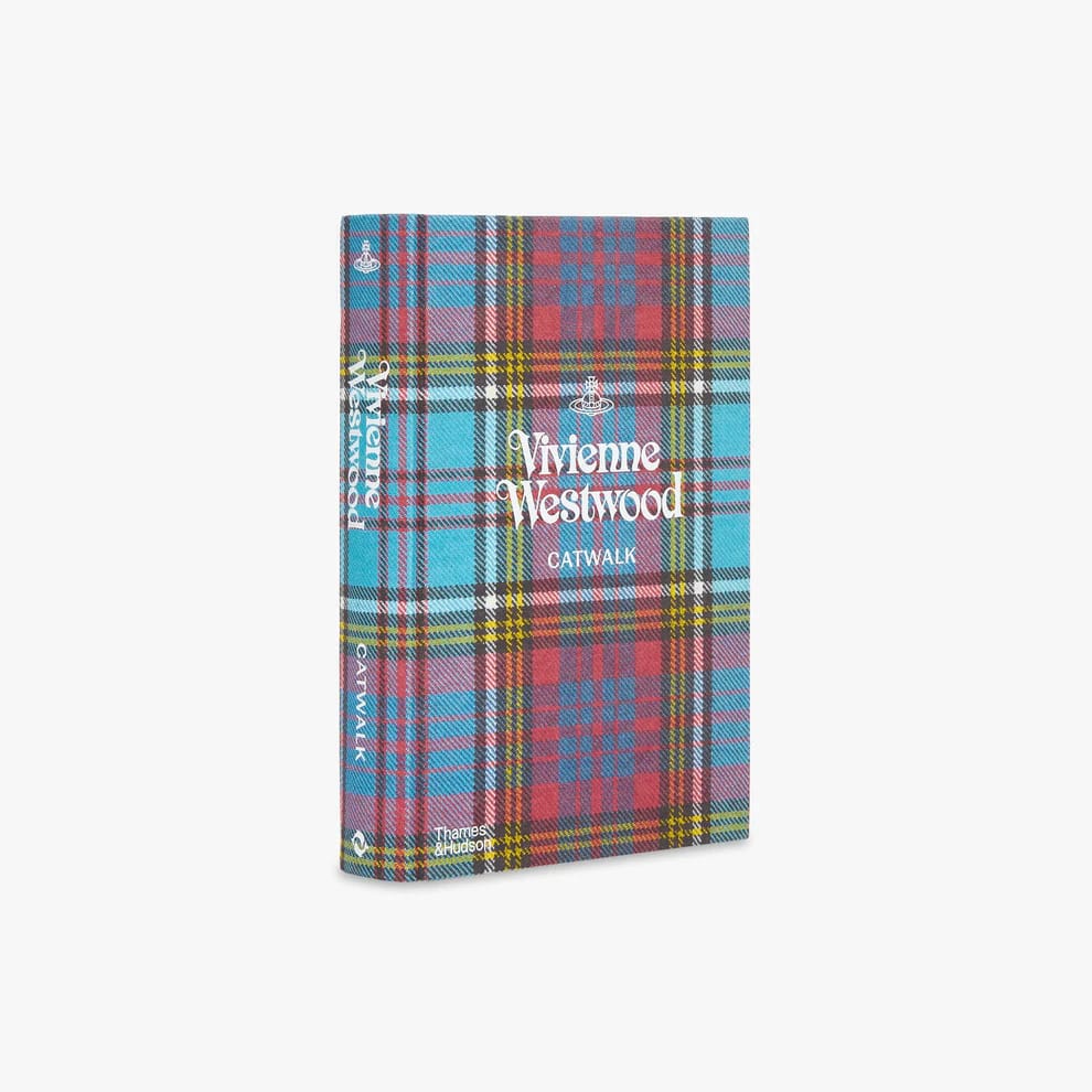 A bue and red tartan book titled 'Vivenne Westwood Catwalk'