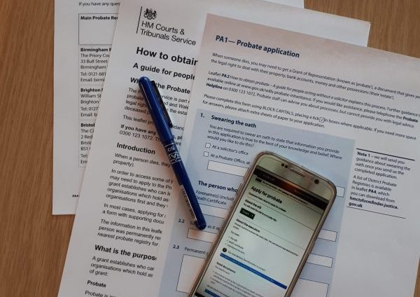 probate forms and phone on desk