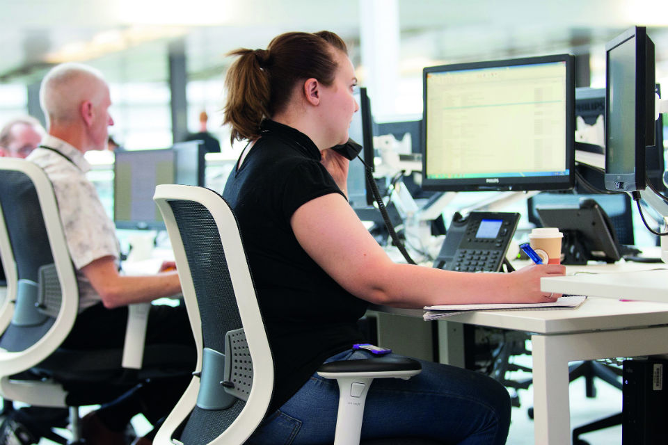 People working at computer screens