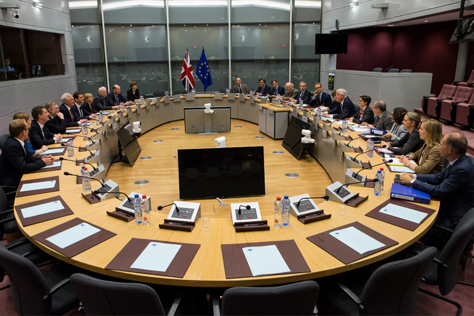 Officials round a negotiating table