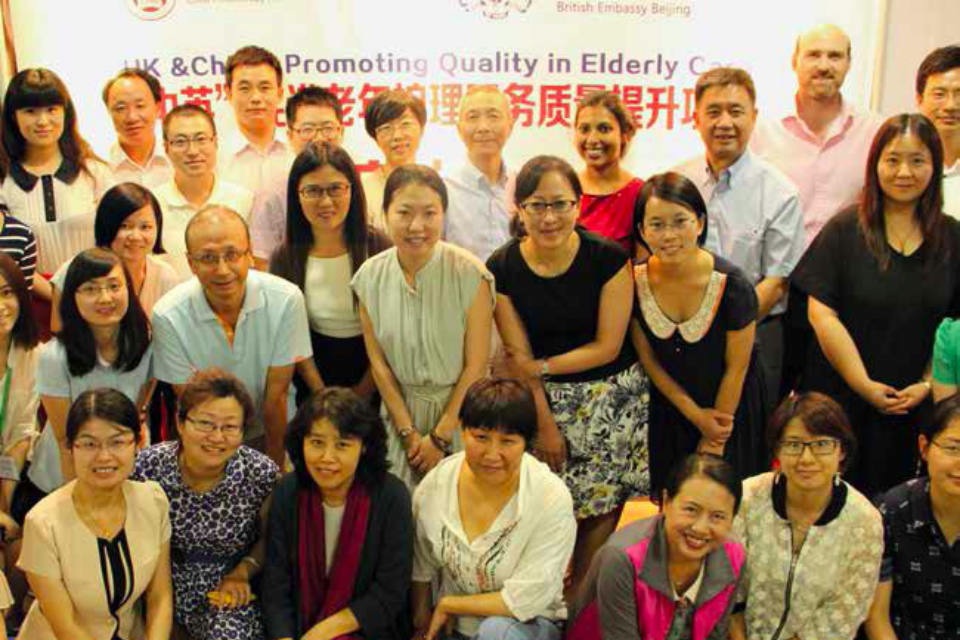 Sarasa Poduval (in red at back) with colleagues at an elderly care conference in China