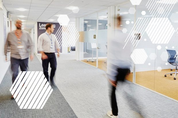 People walking in the Companies House office.