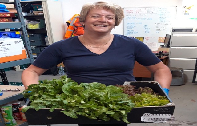 Sue with vegetables from our Foodbank