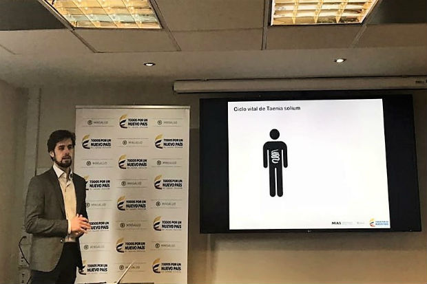 Francisco standing in front of a presentation