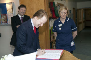 Ben Gummer MP signs in at St Julia's Hospice, Hayle.