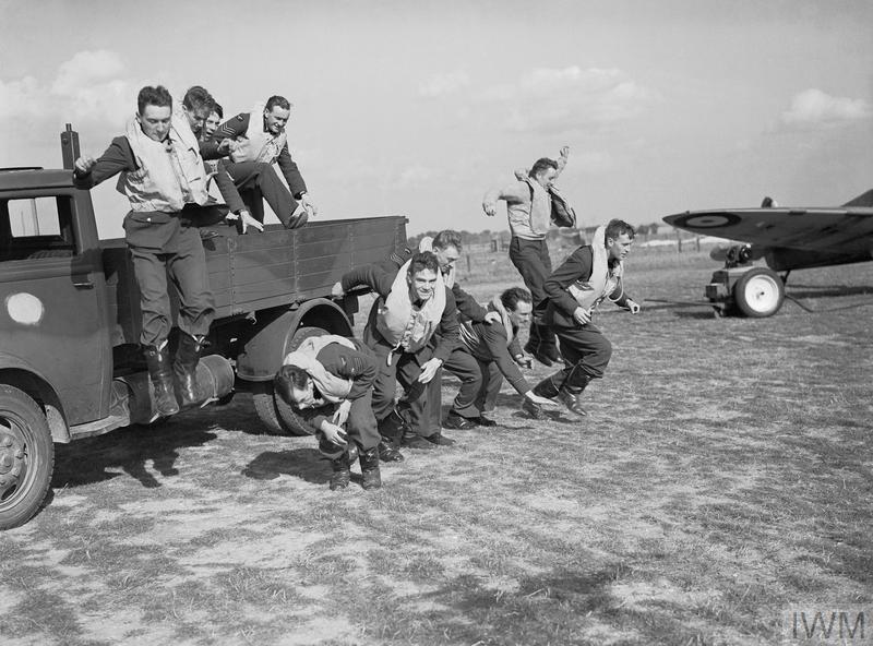 Pilots 'scramble' for the photographer, from the back of a lorry.