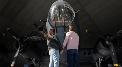 Visitors looking up at a B-17 Flying Fortress in the American Air Museum