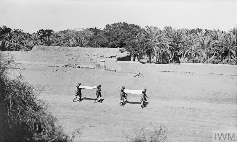  Indian troops who died of influenza being carried to the burning ghats © Q 13074