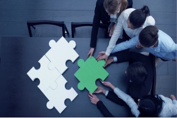people making a puzzle together