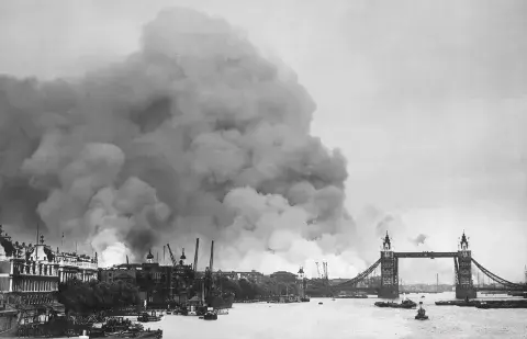 Black and white image showing the aftermath of a bombing raid on the city of London. 