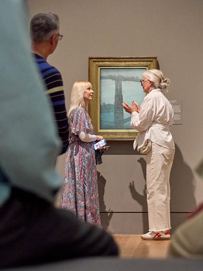 Person stood looking at painting