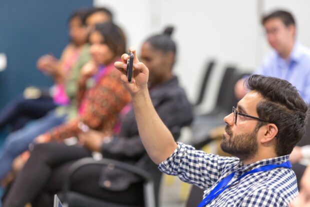 People taking part in an event about making public services.