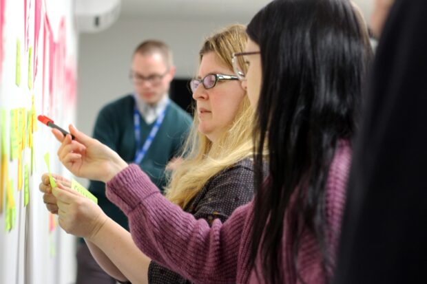 A photo of public sector workers making a policy or service.