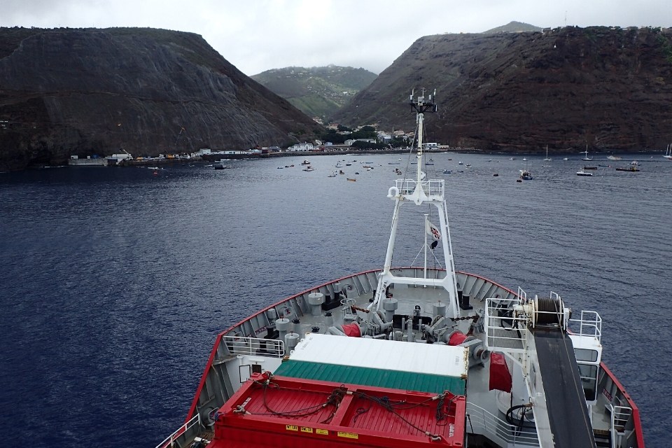 a ship in a bay by an island