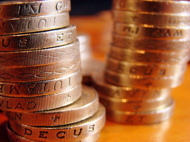 Photo of two piles of pound coins