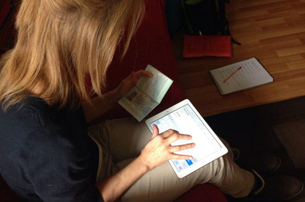 Participant with rheumatoid arthritis in her fingers using Passports service on tablet