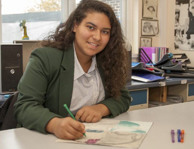 Girl pupil at desk