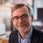 Professor Bob Steele smiling from an office location