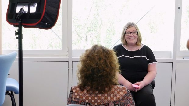 Deb from Digital Voices interviewed by a camera crew
