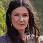 Image of Sarah next to a lake