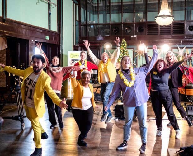 Eight WIILMA volunteers cheering