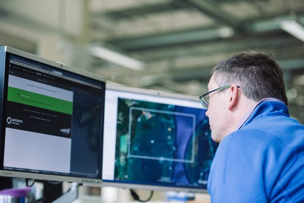 UKHO staff member looking at geospatial data on a monitor