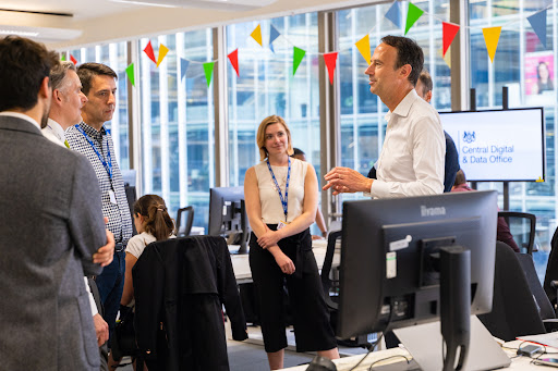 Staff members in discussion at the CDDO office in London