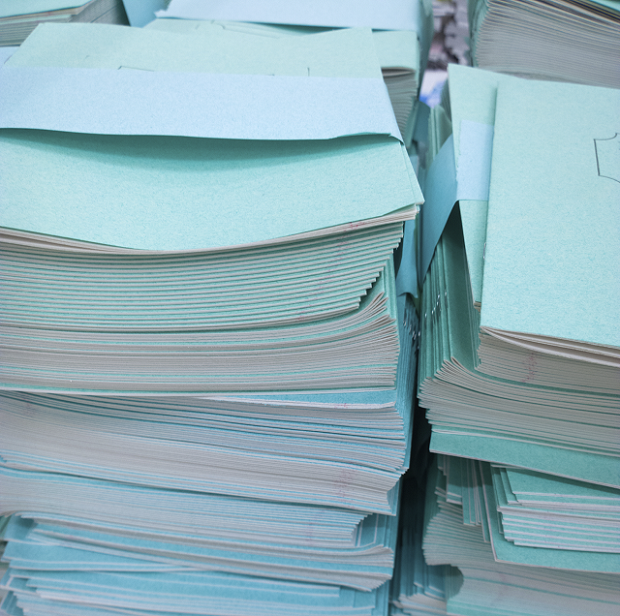 pile of notebooks and papers