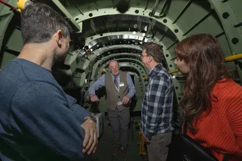 Visitors enjoy a tour of the Avro Lancaster at IWM Duxford.