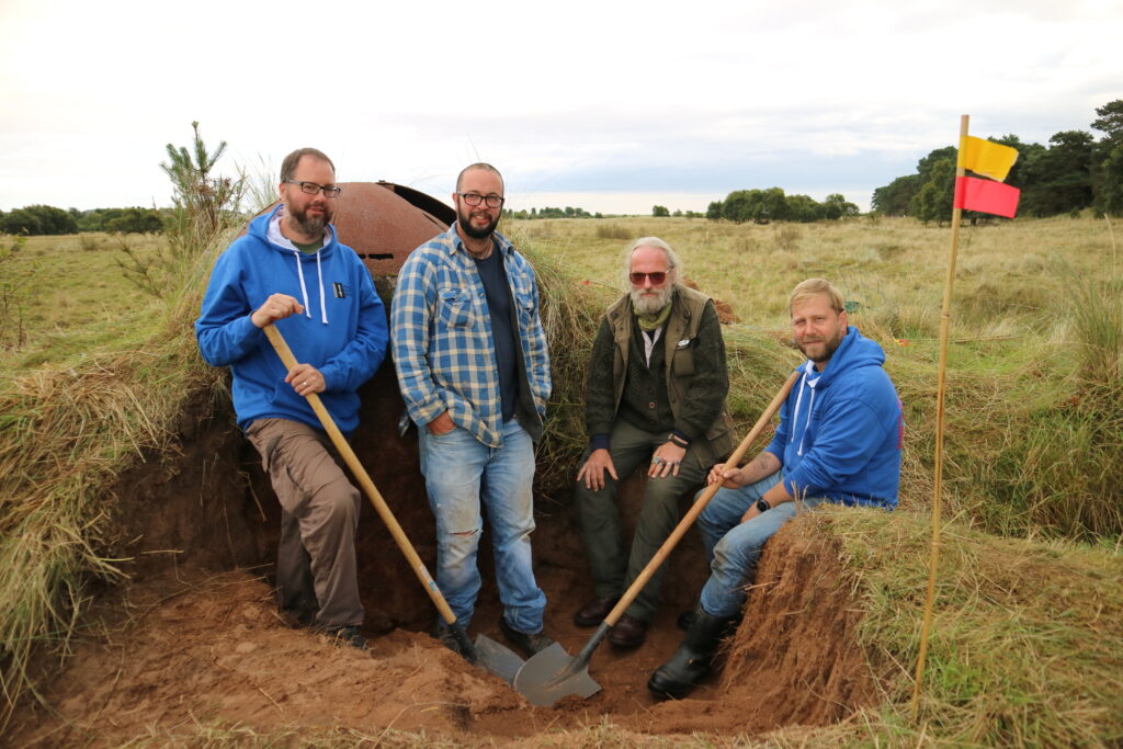 Left to right: Alex Sotheran, DIO archaeologist; Sam Fairhead, Wessex Archaeology; Stewart Bowman, veteran participant; Dickie Bennett, Breaking Ground Heritage. [Crown Copyright / MOD 2017]