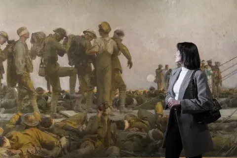 A woman views the John Singer Sargent artwork, Gassed.