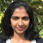 Dr Nisha Jayatilleke looking into camera