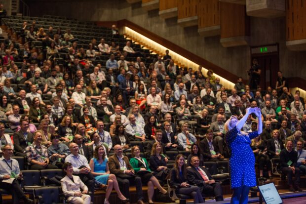 Trisha Doyle on the stage and Sprint 18 audience