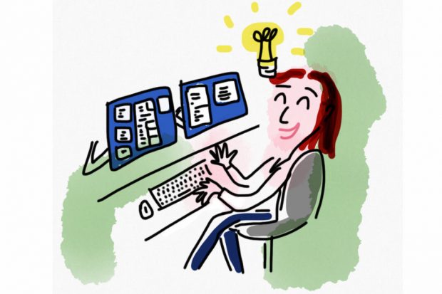 Content designer working on dual screens with light bulb above head signifying a positive idea.