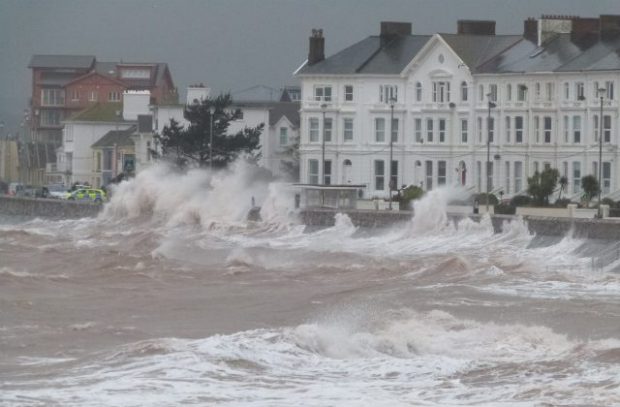 High seas coming up against the Exmouth harbour.
