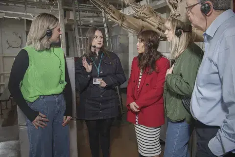 Visitors enjoy a tour of HMS Belfast.