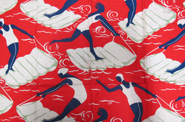 'Surfers' dress fabric; abstract images of women in various poses who are surfing on beach lilos