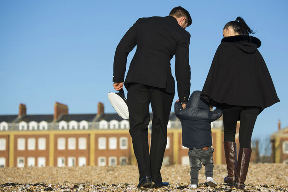Naval officer with partner and child
