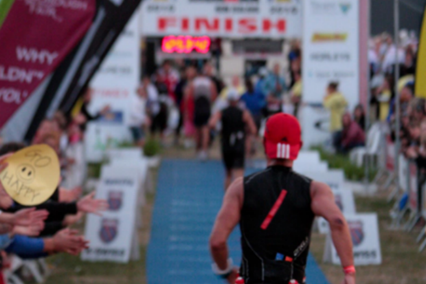 Michael approaching the finish line in an Ironman race