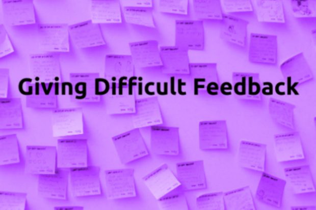 Legend 'Giving Difficult Feedback' on a background of post-it notes