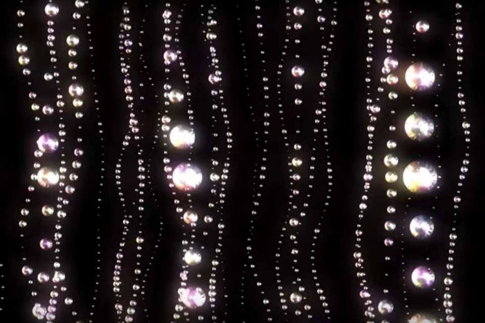 Strings of diamonds on black background