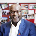John James, chief executive of Sickle Cell Society, smiling at the camera