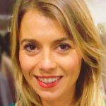 A close up of a lady, Emily McBride, smiling at the camera