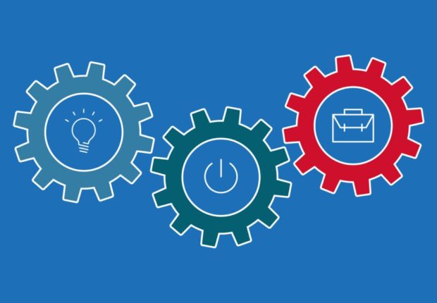 Three cogs of varying colours with individual icons in the middle of each cog. From left to right the icons are, a lightbulb, a power button and a briefcase.